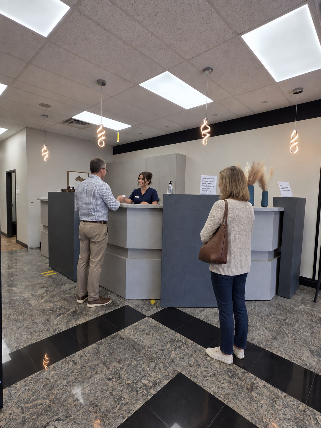 Patients checking in at the Speedvale Medical Clinic reception desk